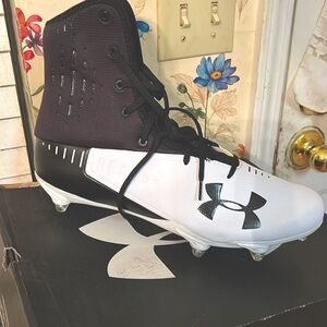 Football cleats new in box size 14/2E wide ,color. Black and white